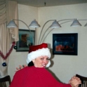 USA ID Boise 7011WestAshland 2001DEC15 ALCC 003  This is Chris' better half Heather trying to be one of Santa's little helpers. I don't think beating up the kids is on the job description though. : 2001, 7011 West Ashland, Americas, Boise, Christmas, Christmas Cheer, Date, December, Events, Idaho, Month, North America, Places, USA, Year